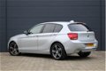 BMW 1-serie - 118i Business Line Sport Automaat (GROOT-NAVIGATIE, LEDER, HARMAN/KARDON SPORTSTOELEN, - 1 - Thumbnail
