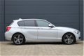 BMW 1-serie - 118i Business Line Sport Automaat (GROOT-NAVIGATIE, LEDER, HARMAN/KARDON SPORTSTOELEN, - 1 - Thumbnail