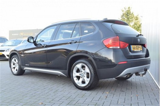 BMW X1 - 1.8d sDrive Executive Automaat Navi/Camera Ecc Cruise Pdc Priv/glass Trekhaak - 1