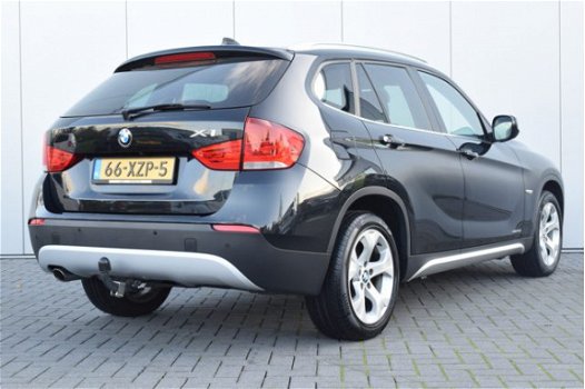 BMW X1 - 1.8d sDrive Executive Automaat Navi/Camera Ecc Cruise Pdc Priv/glass Trekhaak - 1