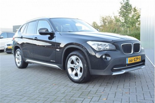 BMW X1 - 1.8d sDrive Executive Automaat Navi/Camera Ecc Cruise Pdc Priv/glass Trekhaak - 1