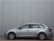 Seat Leon ST - 1.2 TSI 110pk Style automaat | Automaat | Cruise control | Climate control | Lichtmet - 1 - Thumbnail