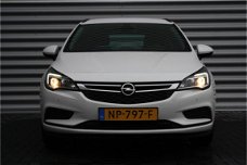 Opel Astra Sports Tourer - 1.0 TURBO 105PK ONLINE EDITION / NAVI / AIRCO / LED / AGR / PDC / ONSTAR