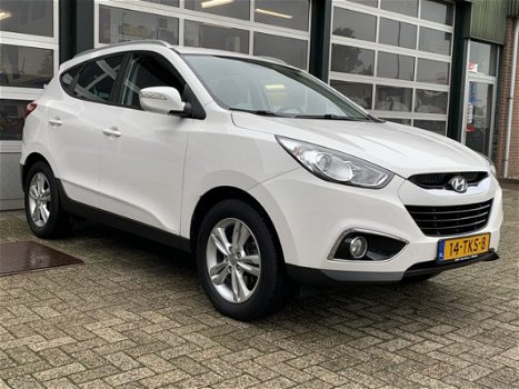 Hyundai ix35 - 2.0i 4WD Business Edition EEC Navigatie Cruise control Trekhaak 1900 kg L.M. velgen - 1