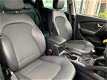 Hyundai ix35 - 2.0i 4WD Business Edition EEC Navigatie Cruise control Trekhaak 1900 kg L.M. velgen - 1 - Thumbnail