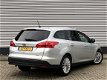 Ford Focus Wagon - 1.0 EcoBoost 100pk Titanium | Navigatie met bluetooth | Parkeersensoren voor en a - 1 - Thumbnail