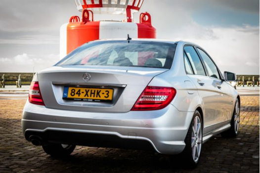 Mercedes-Benz C-klasse - 180 AMG Automaat Xenon | Navi | PDC V+A | Clima | 18'' LMV | NL 1e Eig. Aut - 1