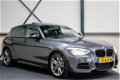 BMW 1-serie - M135i xDrive High Executive ✅320pk 6-cilinder Dealer|M Performance|Schuifdak|Navi|Came - 1 - Thumbnail