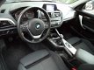 BMW 1-serie - 116i Business+, 5 drs, Fullmap Navigatie, LM Velgen, PDC, Multifunctioneel stuurwiel, - 1 - Thumbnail