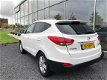 Hyundai ix35 - 1.6i GDI Business Edition Pano dak Half Leer - 1 - Thumbnail