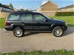 Jeep Grand Cherokee - Grand-cherokee 2.7CRD 4x4 Automaat LUXE - 1 - Thumbnail