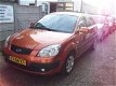 Kia Rio - 1.4 L met airco/navigatie - 1 - Thumbnail