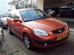 Kia Rio - 1.4 L met airco/navigatie - 1 - Thumbnail