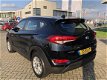 Hyundai Tucson - 1.6 GDi i-Motion/Autm Airco/Cruise/Sensoren achter - 1 - Thumbnail