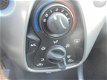 Toyota Aygo - 1.0 VVT-i x-play ayco benzine 5 deurs airco 26000 km eerste eigenaar - 1 - Thumbnail
