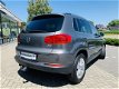 Volkswagen Tiguan - 1.4 TSI Sport&Style | TREKHAAK 1.600 KILO | STOELVERWARMING | NAVIGATIE | CRUISE - 1 - Thumbnail