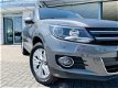 Volkswagen Tiguan - 1.4 TSI Sport&Style | TREKHAAK 1.600 KILO | STOELVERWARMING | NAVIGATIE | CRUISE - 1 - Thumbnail