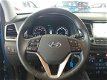 Hyundai Tucson - 1.6 GDi Comfort / Navigatie - Parkeerhulp - Stoelverwarming voor en achter - Verkee - 1 - Thumbnail