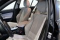 BMW 1-serie - 118d Business Sport | Navigatie | LM 17 Inch | Airco | Xenon | Leder | - 1 - Thumbnail