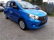 Suzuki Celerio - 1.0 COMFORT 5 DEURS / 45.347 KM / AIRCO / DAGRIJVERL. / ELEK RMN / C.VERGR.AFSTAND. - 1 - Thumbnail