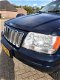 Jeep Grand Cherokee - 4.7i V8 Overland High Output in opdracht van klant, lichtbalk is eraf white sa - 1 - Thumbnail