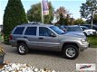 Jeep Grand Cherokee - 2.7 CRD High Roof 2002 Youngtimer Grijs kenteken AIRCO - 1 - Thumbnail