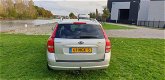 Kia Cee'd Sporty Wagon - 1.4 CVVT Seven 1e eigenaar Navi airco cruis control cv op afs elekramen - 1 - Thumbnail