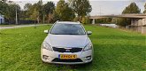 Kia Cee'd Sporty Wagon - 1.4 CVVT Seven 1e eigenaar Navi airco cruis control cv op afs elekramen - 1 - Thumbnail