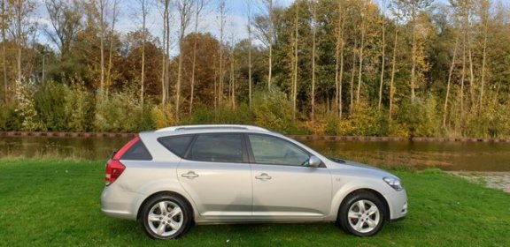 Kia Cee'd Sporty Wagon - 1.4 CVVT Seven 1e eigenaar Navi airco cruis control cv op afs elekramen - 1