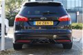 Ford Focus Wagon - 2.0 EcoBoost ST-2 280 PK wolf in schaapskleren - 1 - Thumbnail