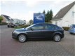 Ford Focus - 2.0 Titanium (Airco, Stoelverwarming, Keyless, Afn.Trekhaak, PDC) - 1 - Thumbnail