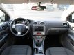 Ford Focus - 2.0 Titanium (Airco, Stoelverwarming, Keyless, Afn.Trekhaak, PDC) - 1 - Thumbnail