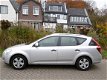 Kia Cee'd Sporty Wagon - 1.4i 109pk Airco Trekhaak 1200kg 2e eigenaar - 1 - Thumbnail