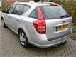 Kia Cee'd Sporty Wagon - 1.4i 109pk Airco Trekhaak 1200kg 2e eigenaar - 1 - Thumbnail