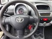 Toyota Aygo - 1.0-12V Comfort, bj.2010, 1e eigenaar, airco, 5 deurs, zwart, APK tot 02-2020, 218800 - 1 - Thumbnail