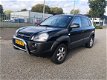 Hyundai Tucson - 2.0i Dynamic AIRCO/ELEK.R/ NAP/NETTE AUTO - 1 - Thumbnail