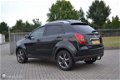 SsangYong Korando - 2.0 XDI Sapphire HR 4x4 AUT Grijs kent. Leder - 1 - Thumbnail