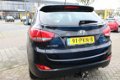 Hyundai ix35 - 2.0i Business Edition AUTOMAAT / NAVIGATIE / TREKHAAK - 1 - Thumbnail