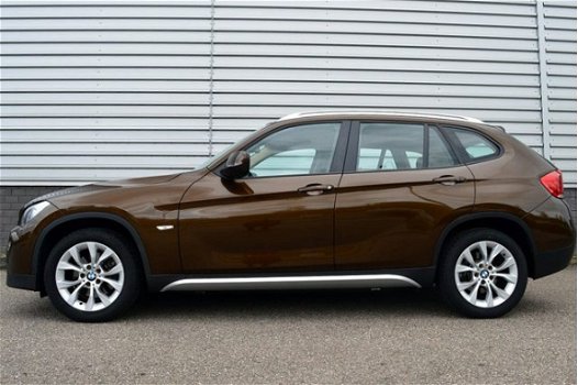 BMW X1 - 1.8i sDrive Executive RIJKLAAR PRIJS-GARANTIE Navigatie Leder Sport Interieur - 1