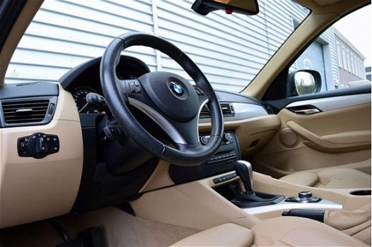 BMW X1 - 1.8i sDrive Executive RIJKLAAR PRIJS-GARANTIE Navigatie Leder Sport Interieur - 1