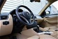 BMW X1 - 1.8i sDrive Executive RIJKLAAR PRIJS-GARANTIE Navigatie Leder Sport Interieur - 1 - Thumbnail