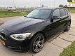 BMW 1-serie - 116i Business+ AUTOMAAT Xenon Navigatie SPORTLINE 163102 KM N.A.P 2012 - 1 - Thumbnail