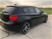BMW 1-serie - 116i Business+ AUTOMAAT Xenon Navigatie SPORTLINE 163102 KM N.A.P 2012 - 1 - Thumbnail