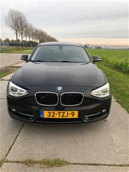 BMW 1-serie - 116i Business+ AUTOMAAT Xenon Navigatie SPORTLINE 163102 KM N.A.P 2012 - 1