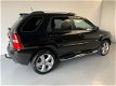 Kia Sportage - 2.7 V6 M-bition 4WD Automaat Leer Climate - 1 - Thumbnail