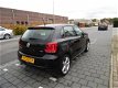 Volkswagen Polo - 1.2 TSI Comfortline 5 deurs , airco, sportvelgen , 6 versnellingen en navigatie - 1 - Thumbnail