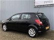 Opel Corsa - 1.2-16V Cosmo Automaat/Climate/16inch/PDC achter - 1 - Thumbnail