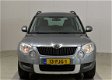 Skoda Yeti - 1.2 TSI Ambition Navigatie/Trekhaak / Pdc / Clima /Cruise /Regensensor - 1 - Thumbnail