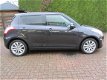 Suzuki Swift - 1.2 Exclusive EASSS / stoelverwarming / climate control / cruise control - 1 - Thumbnail