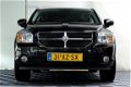 Dodge Caliber - 1.8 SXT 96.000km incl NAP 1eEIGNR SUBWOOFER AIRCO CRUISE '07 - 1 - Thumbnail